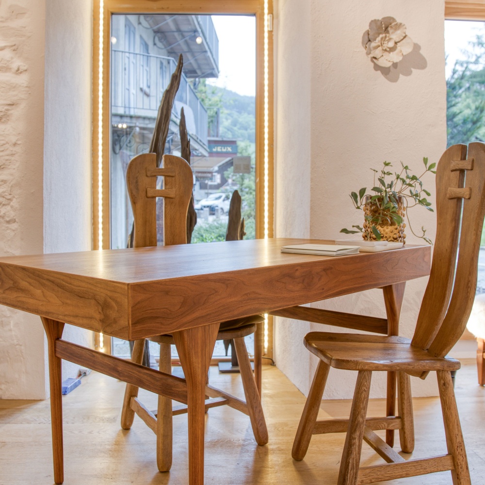 Wooden desk and chairs for a cosy chalet feel.