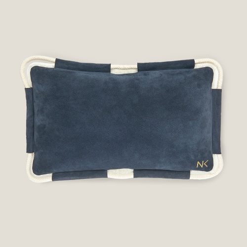 One side navy blue suede, one side natural white velvet shearling.