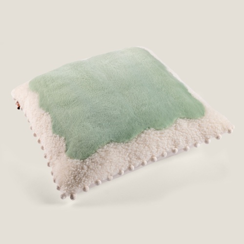 A square cushion in shearling and sheared mink.