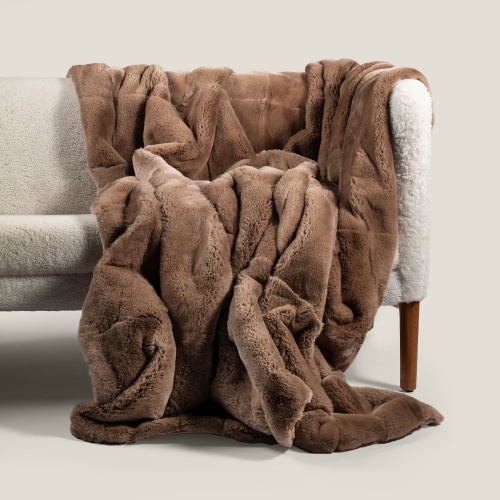 Vintage Hans Wegner sofa and chocolate fur throw for a warm decoration