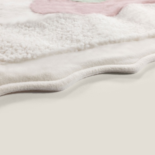 Fur throw as a gift for a feminine pink, green and white bedroom