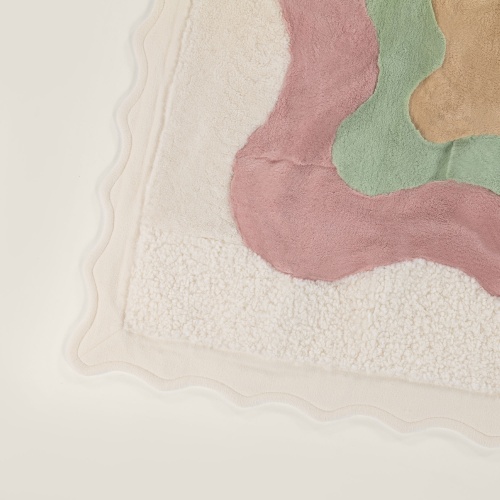 High quality finishes, pastel colors, fur and careful design for this designer haute couture throw