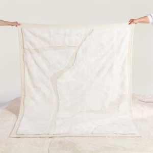 Luxury plain white blanket in high-end natural materials by Maison Norki