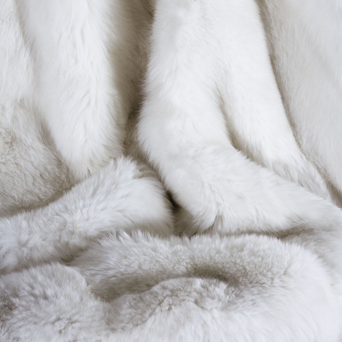 A soft fur blanket, with luxurious finishes and tailor-made in France