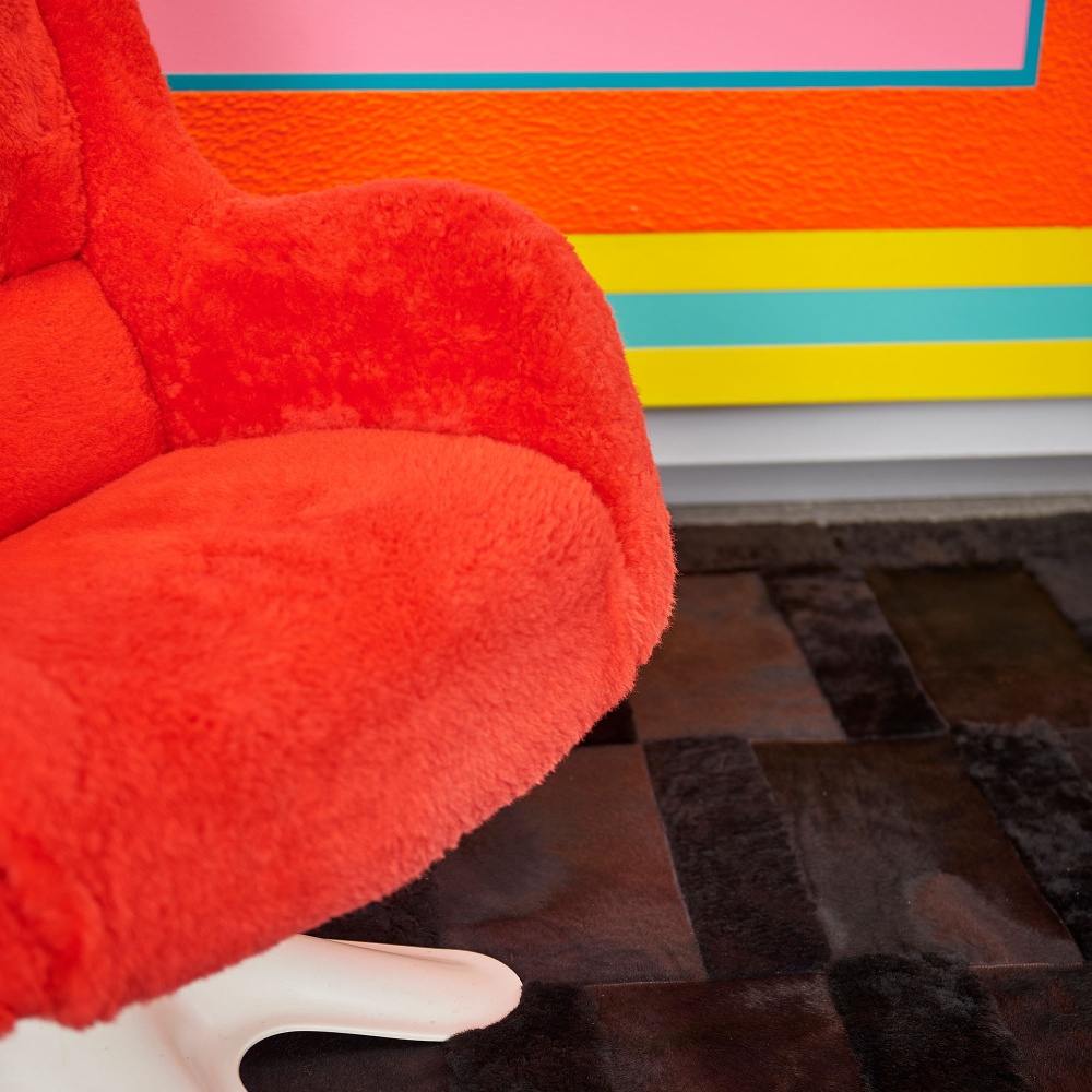 Buy a black rug and a vintage red shearling chair to match a Peter Halley painting