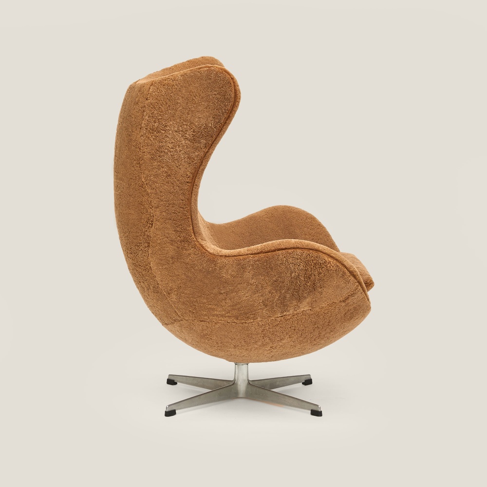 Luxury reading armchair on swivel base in camel sheepskin