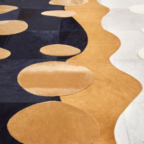 A designer rug with patterns that evoke a path in a Zen garden.