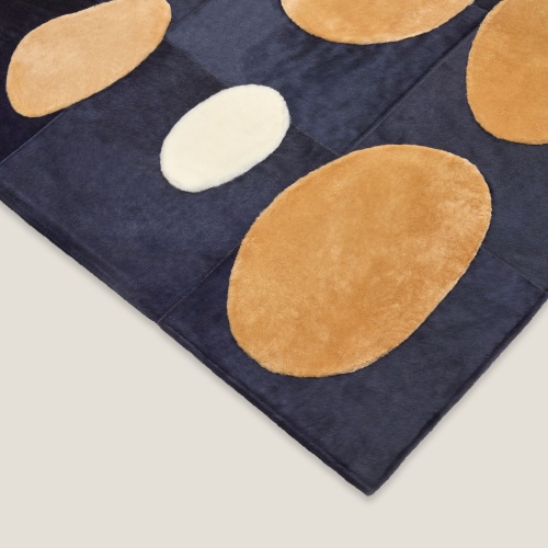 Camel and white yokes on a navy blue background, custom-made by the Norki workshop.