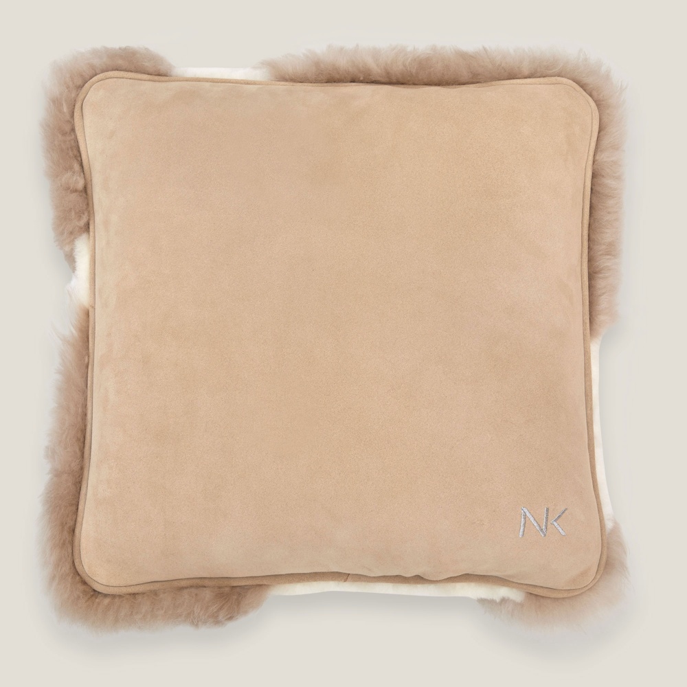 Norki cushion with one side in linen tinted velvet leather.