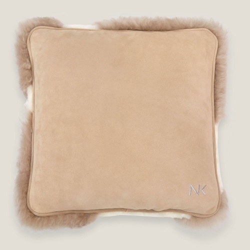 Norki cushion with one side in linen tinted velvet leather.