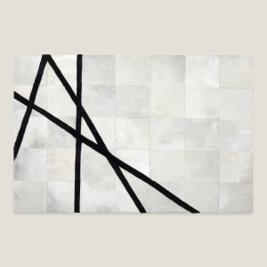 Large Oslo rug signed by Norki in woolly hide, black graphic patterns.