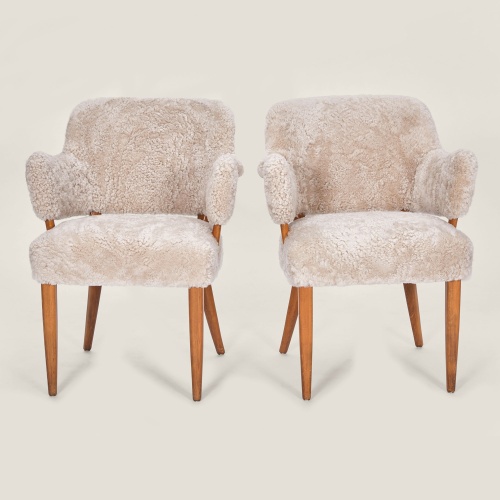 Elegant and luxurious pair of chairs in polish birch tree by Carl Malmsten.