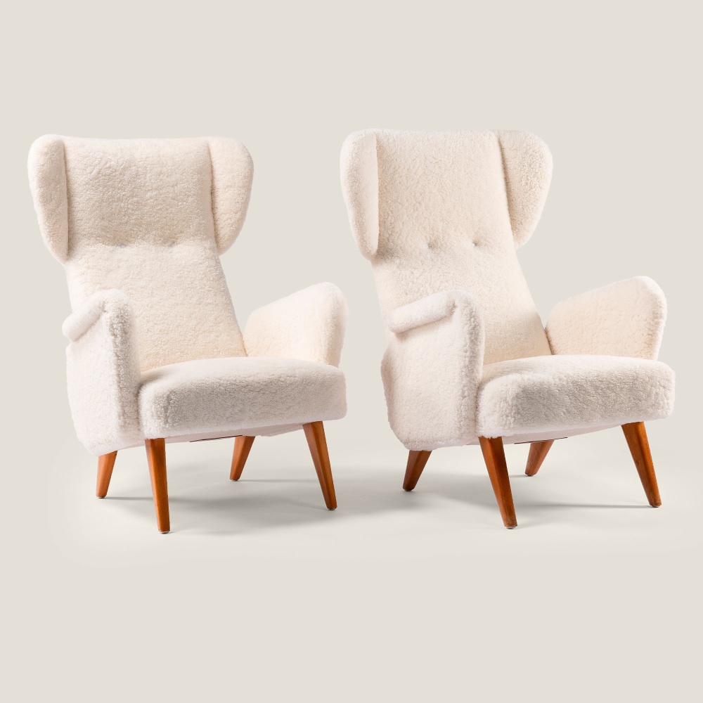 Pair of armchairs signed Carl Gustaf Hiort af Ornäs upholstered in White French Curly shearling.