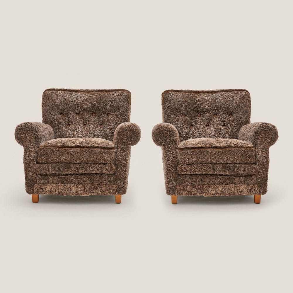 A pair of authentic armchairs made by Dux in Sweden in the 1950s.