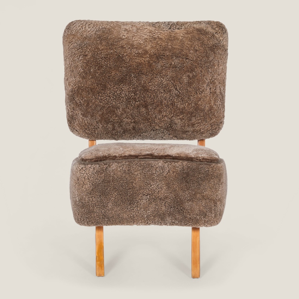 Small comfortable dark beige armchair ideal for small spaces.