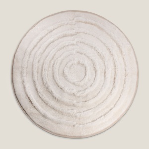 Large round natural white sheepskin rug with a simple but so luxurious design by Norki.