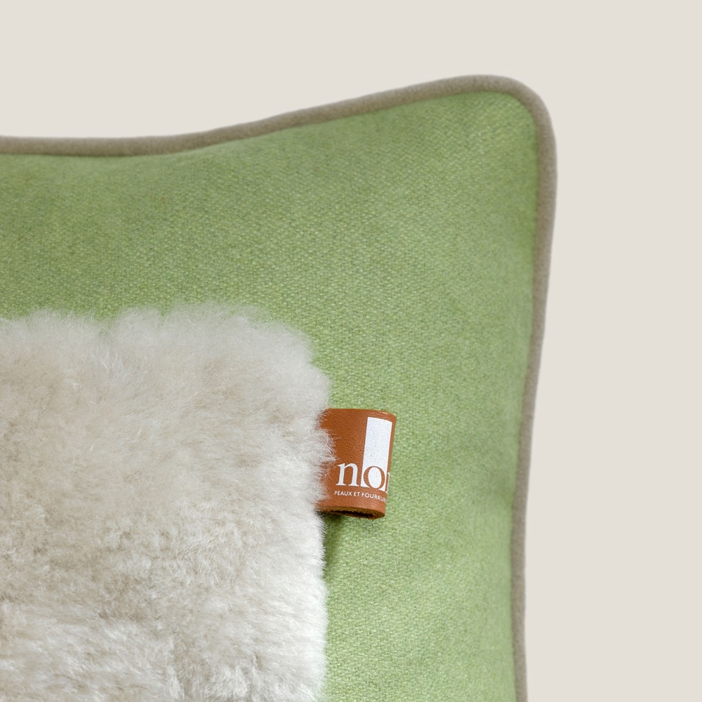 Focus on the Norki detail of the leather cushion. A cushion for Christmas.