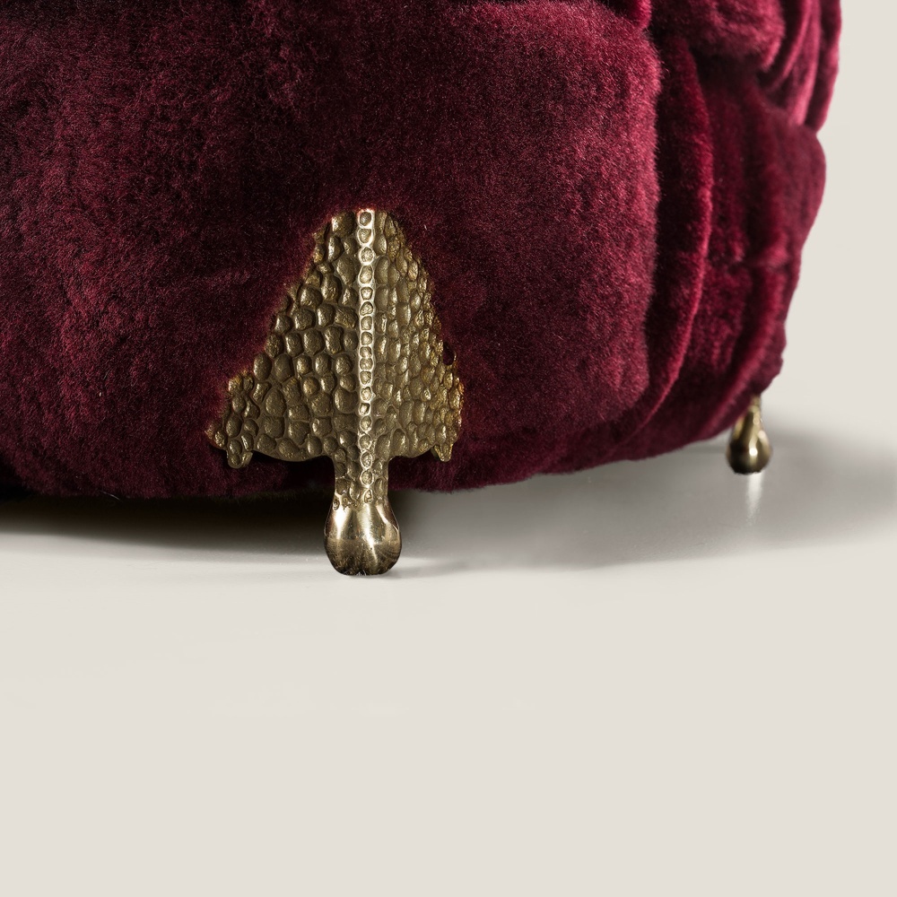 Focus on the brass feet that make this armchair so luxurious.