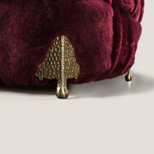 Focus on the brass feet that make this armchair so luxurious.