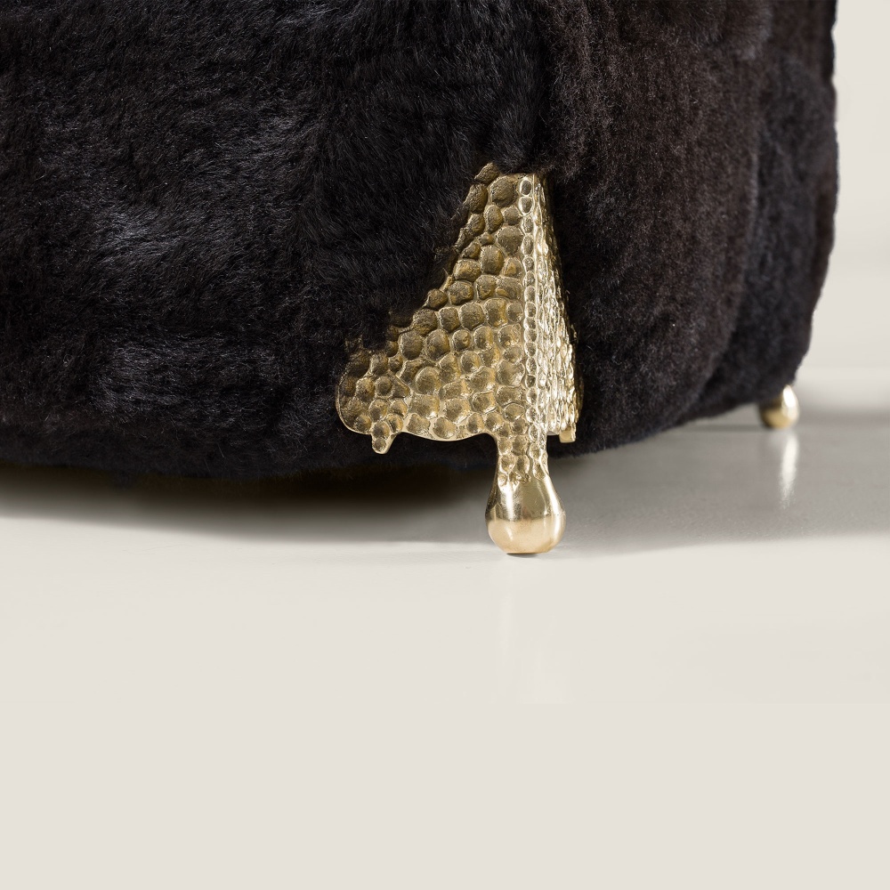 Focus on the brass feet that make this armchair so luxurious.