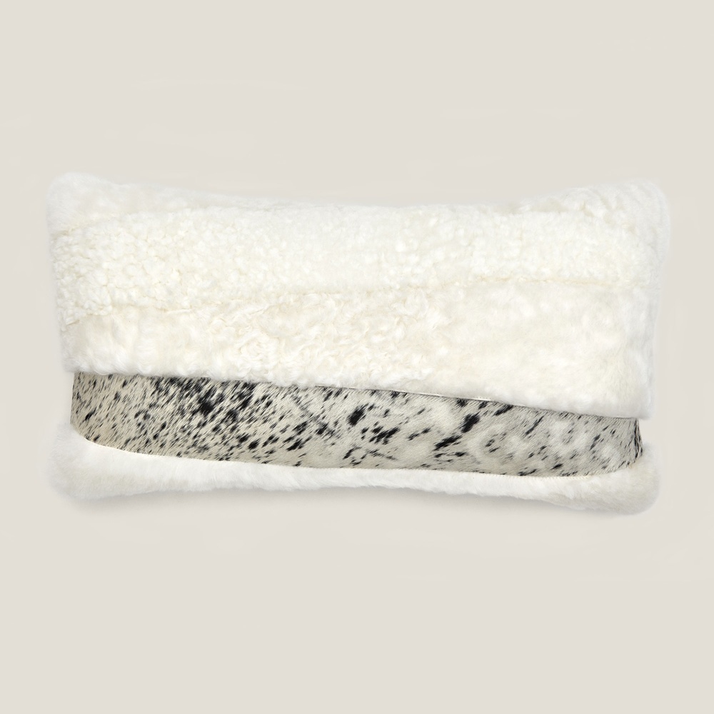 Square Zima rectangle cushion in mottled cowhide and natural sheepskin.