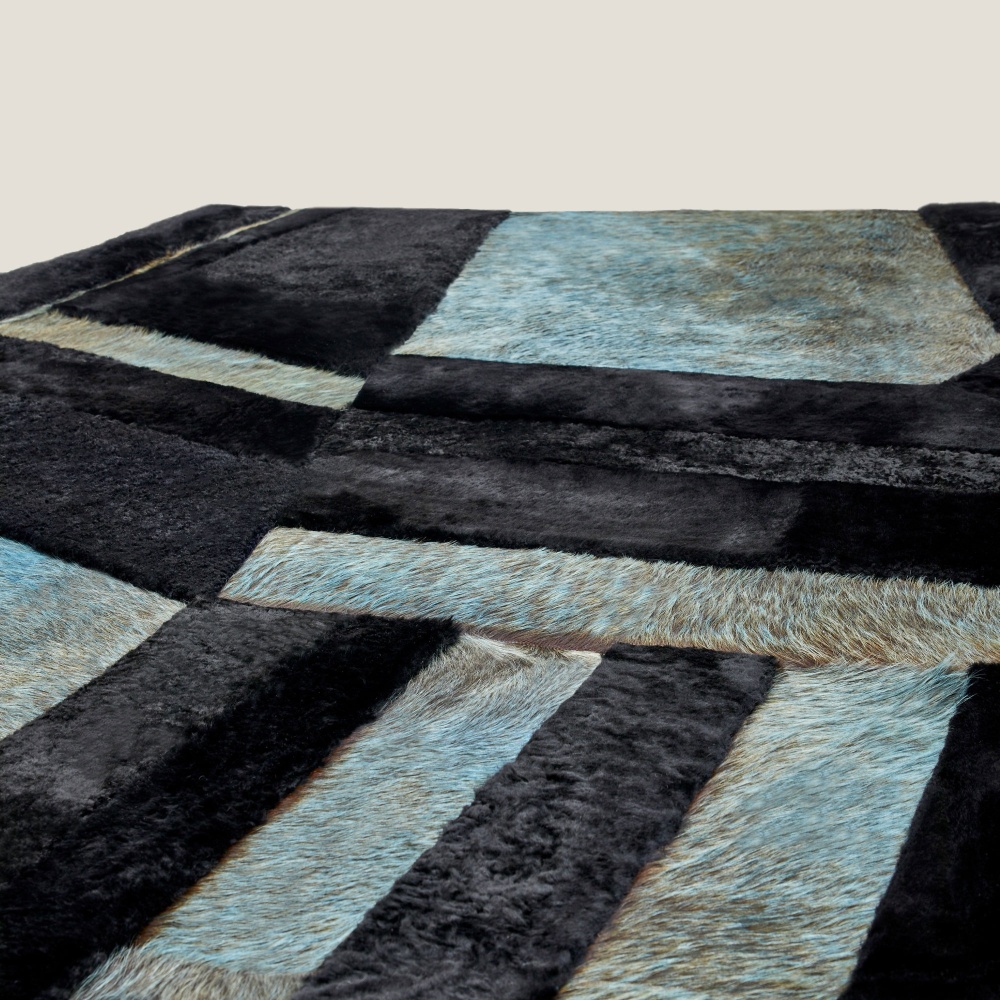 Detail of the finishes on the Forest by Norki rug and the yoke of wool hides forming a geometric pattern.