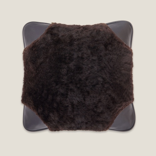 Sarafan Cushion in Black tinted sheared Sheepskin with black leather corners.