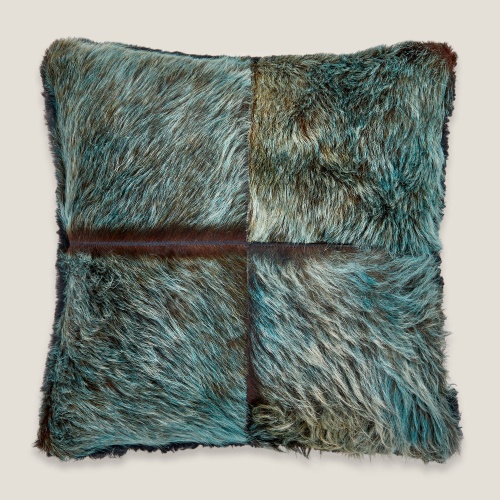 Forest cushion showcasing blue/green cowhide assembly on a side of this square cushion.