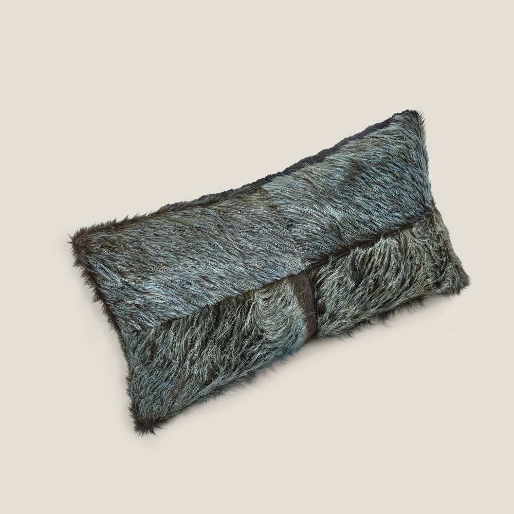 The two-tone blue/green cowhide forms one side of the rectangle Forest cushion.