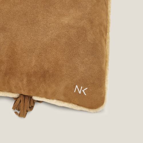 We embroider the initials of your choice on your cushions, a special Norki service.