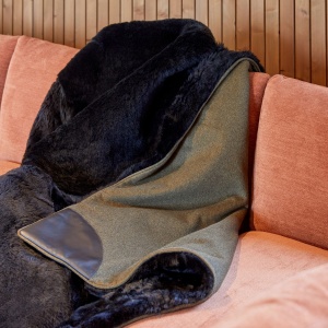 Sarafan Norki throw, a haute couture throw in black and kaki embroideries.