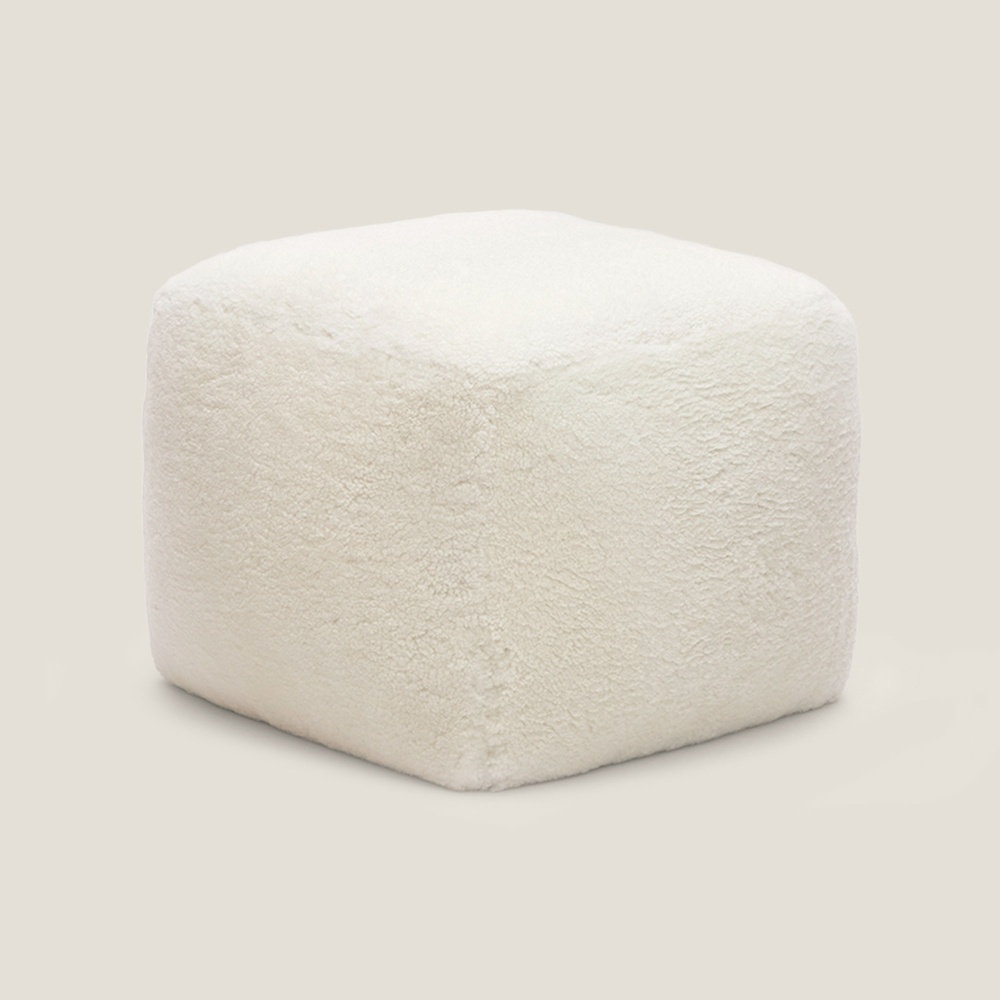 Small white cubic stool in curly woollen leather by Norki.