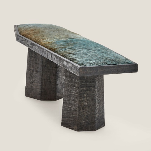 Artisanal solid oak bench with blue/green bicolour cowhide cushion, perfect for a sophisticated terrace.