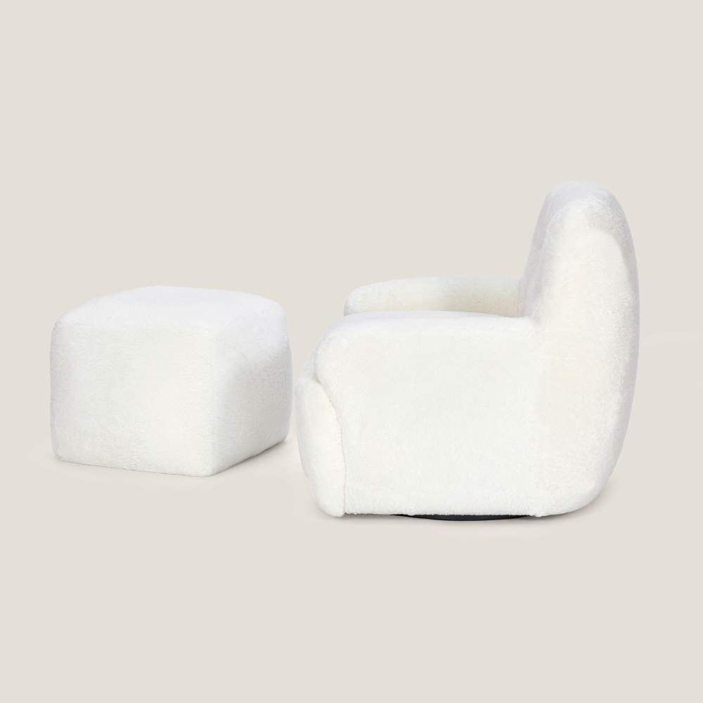 Side view of a magnificent white bouclette armchair and matching footrest.