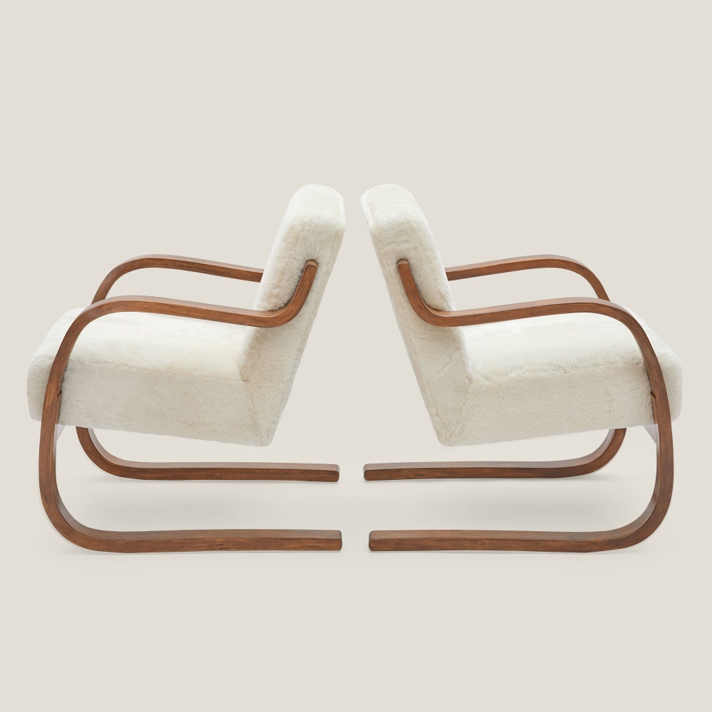 Armchairs with organic, modern curves, an original design by Alvar Aalto.