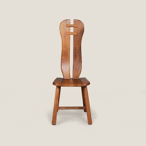 Vintage Brutalist wooden dining chair with sleek, sculptural design.