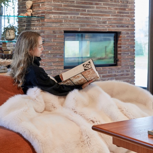 Large luxurious white fur throw for sofa.