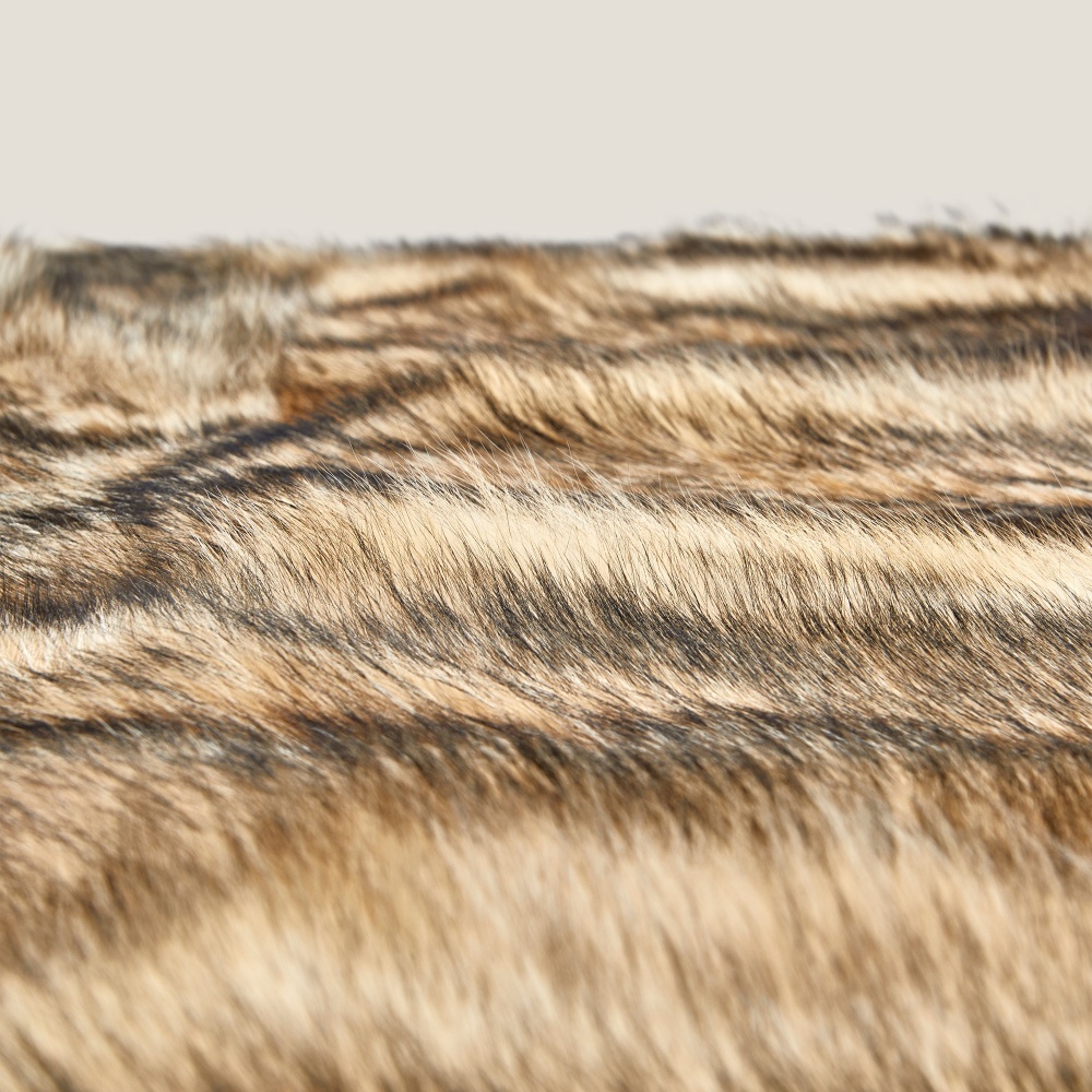 Genuine coyote fur daybed for a stylish, authentic look for your chalet.