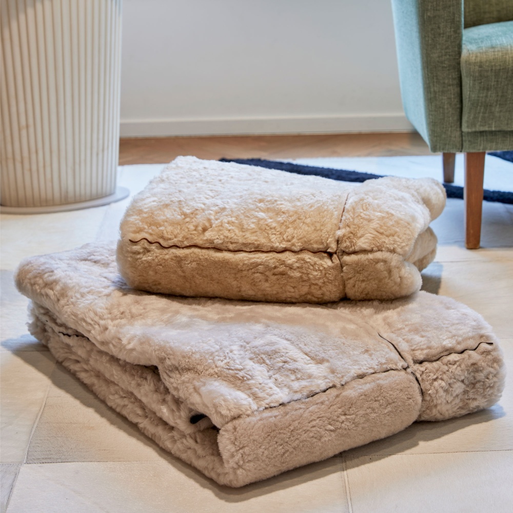 Very soft and comfortable grey sheepskin throw to decorate your chalet.