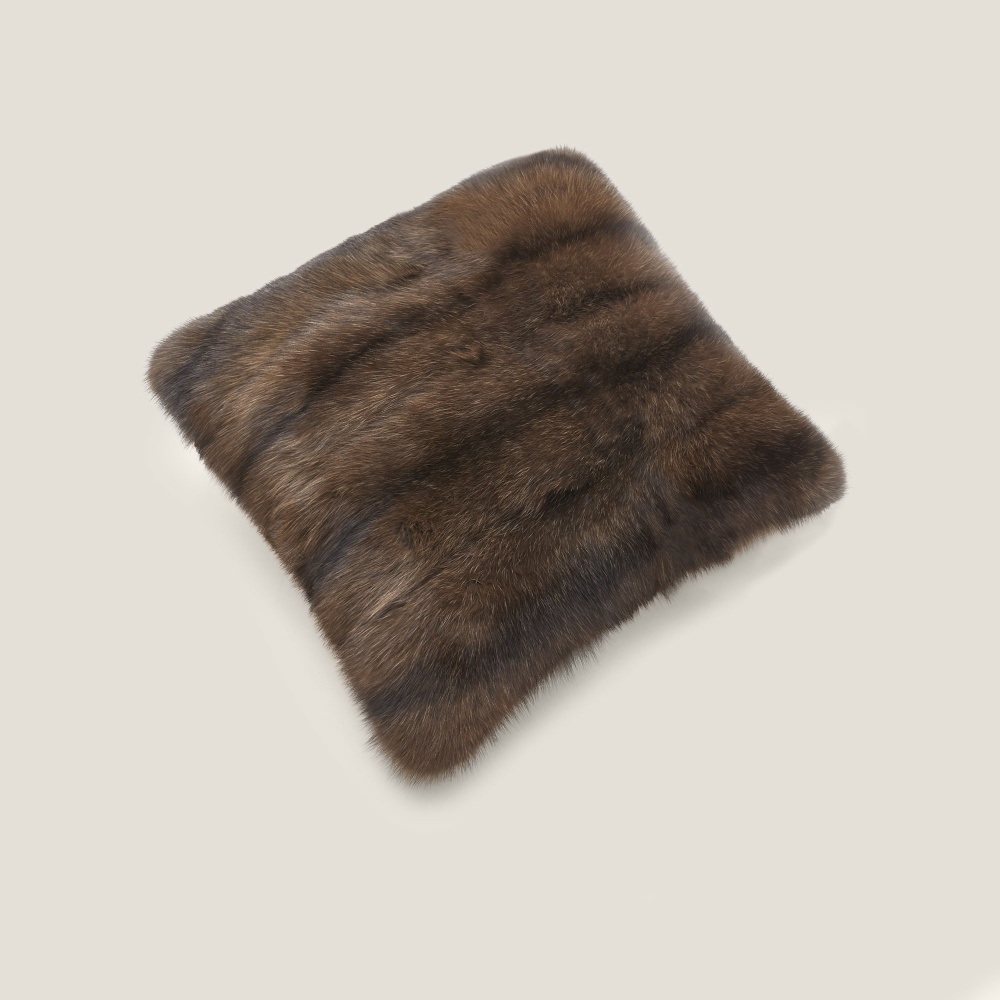 Square cushion in real sable fur for chalet decoration.