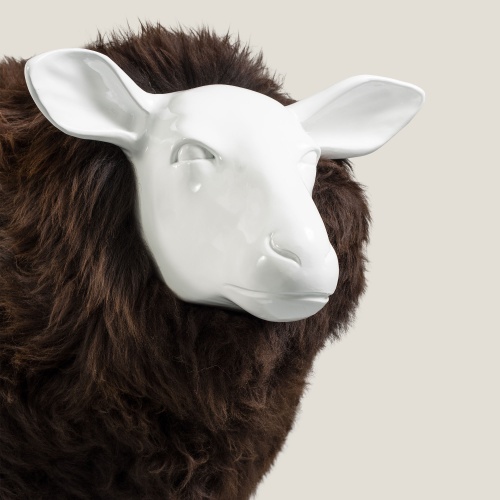 Focus on the precise details of the resin sheep's head.