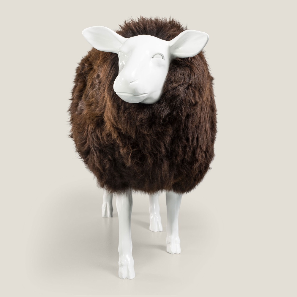 Front of a sculpture of a sheep in smooth resin and chocolate-coloured sheepskin.