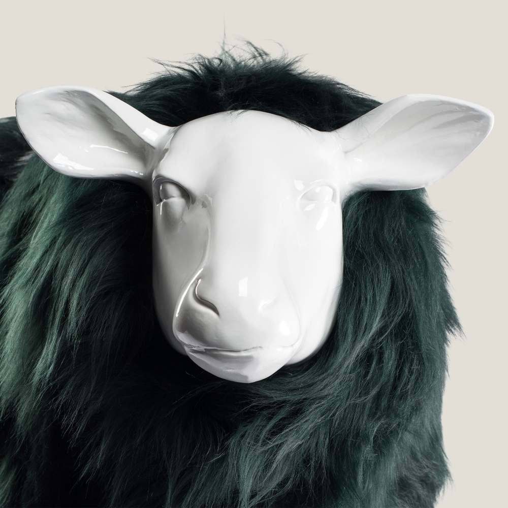 Focus on the details of the resin sheep's head.