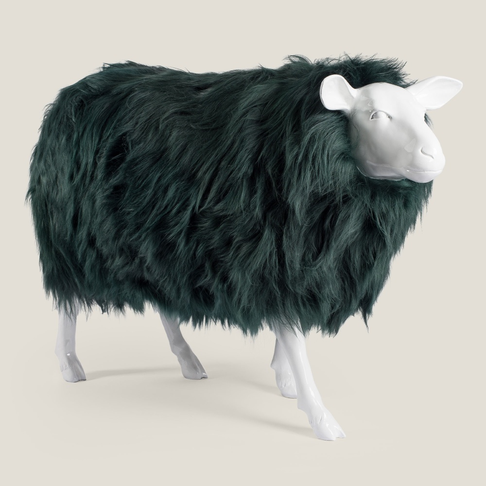 Sheep in smooth resin, covered with green-tinted sheepskin.