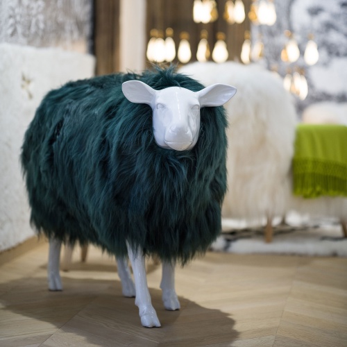 Smooth resin sculpture of a life-size sheep to decorate a chalet.