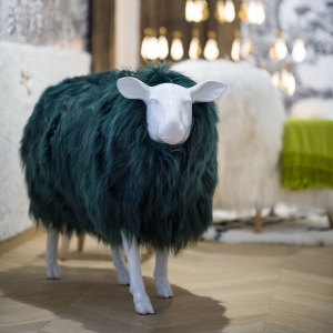 Sheep in smooth resin, covered with green-tinted sheepskin.