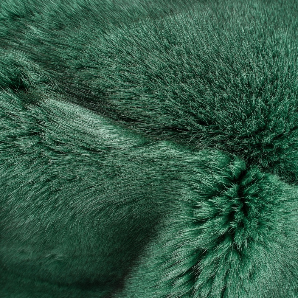 Thickness and quality of the emerald green tinted Arctic fox throw.