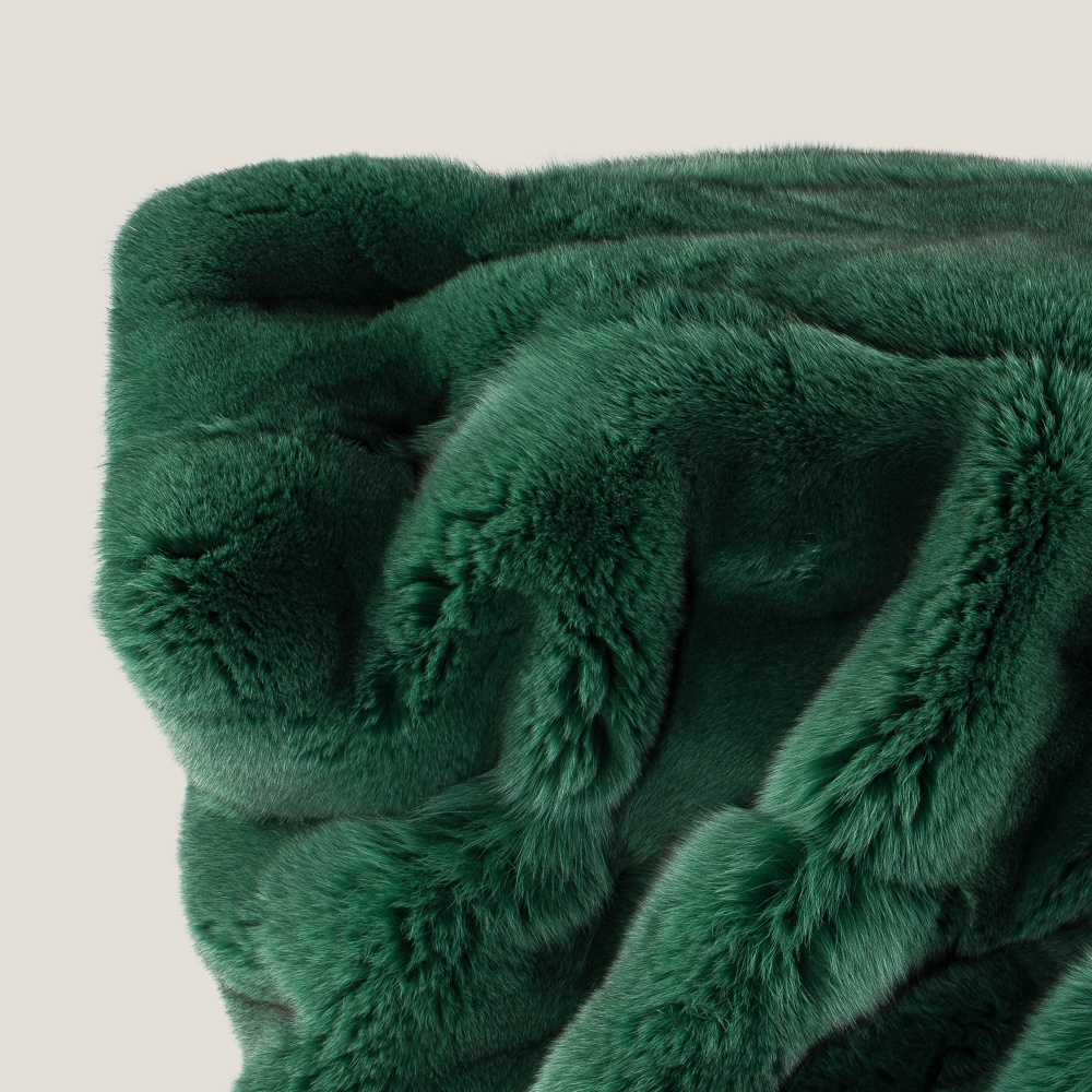 Luxurious texture of the emerald green natural fur throw.