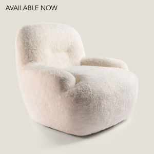 Small, comfortable and elegant white designer armchair, mounted on a 360° swivel metal base.