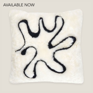 A square shape white cushion with an abysmal blue pattern reflecting the waves of the North Sea. Inner feather cushion.